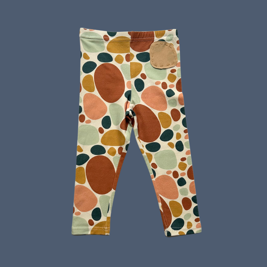 More The Label organic cotton children's clothing stoneprint legging flat lay of front on blue background.