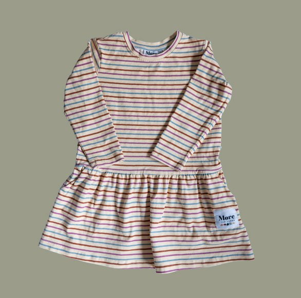 Flat lay image of More the label striped skater dress on soft green background.