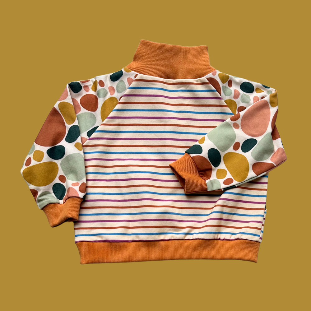 More The Label organic cotton children's clothing Stone Print Jumper flat lay image of back. Features exclusive stone print and custom stripe print. YKK zip opening and hand stitched stone detail. 