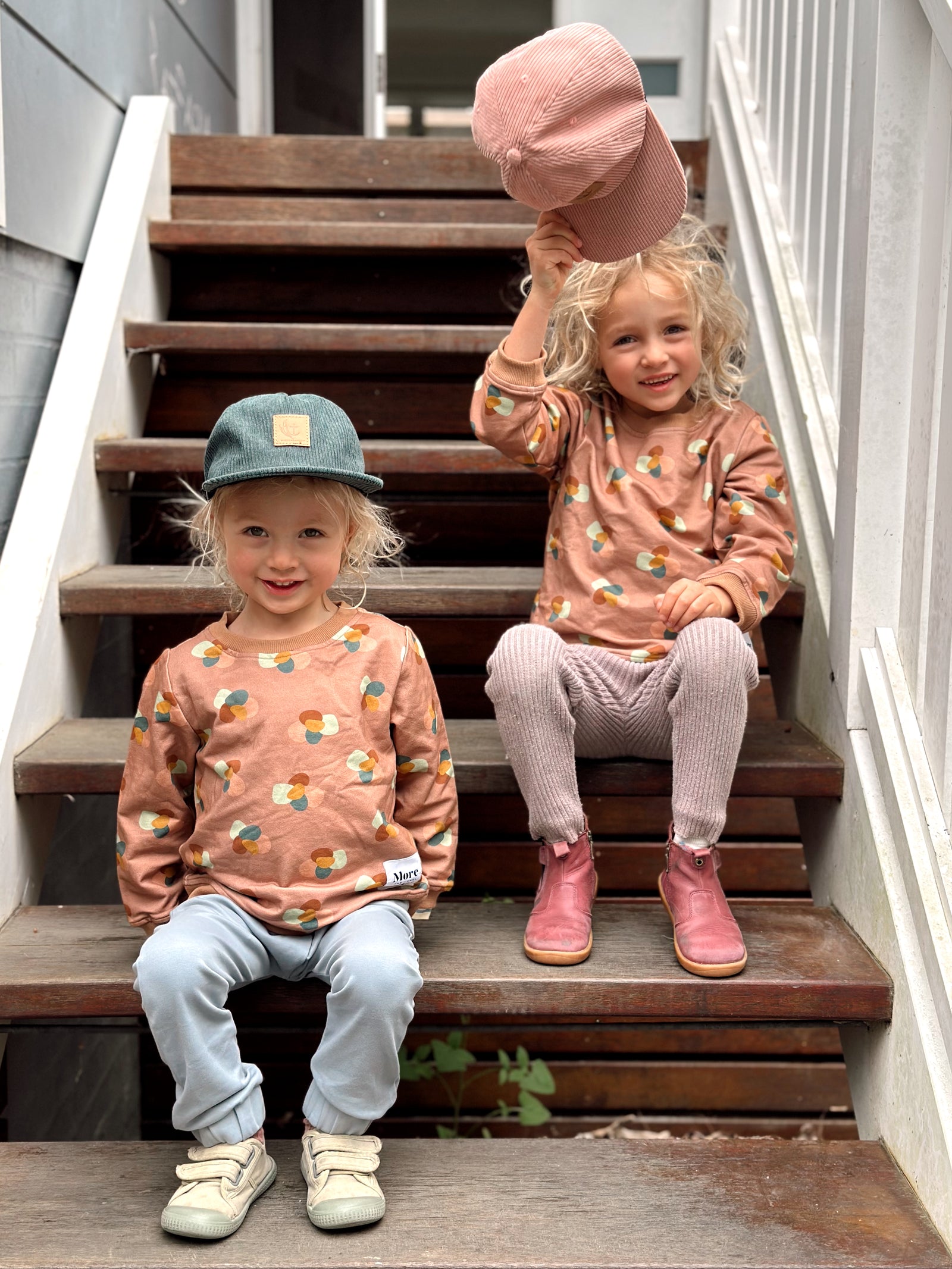 Photo of Gemma Pranita's children wearing More the label for our blog. Iggy wears Stone huddle jumper with dusty blue track pant and Raffa wears Stone huddle jumper with own pants.