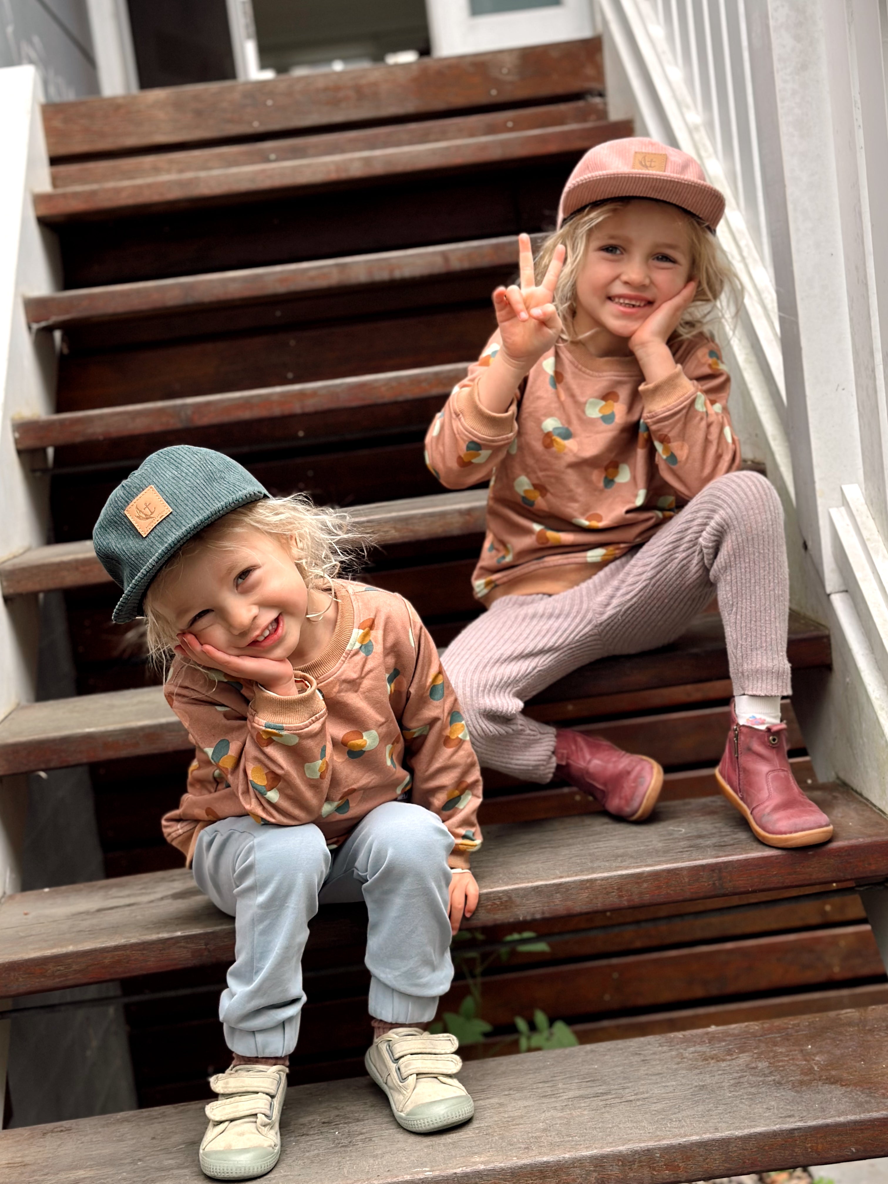 Photo of Gemma Pranita's children wearing More the label for our blog. Iggy wears Stone huddle jumper with dusty blue track pant and Raffa wears Stone huddle jumper with own pants.